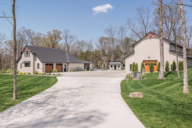 exterior space featuring brick siding, driveway, a front lawn, and a garage