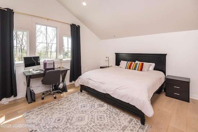bedroom with vaulted ceiling, recessed lighting, and light wood-style floors