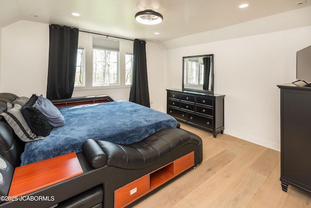 bedroom featuring recessed lighting, baseboards, lofted ceiling, and light wood-type flooring