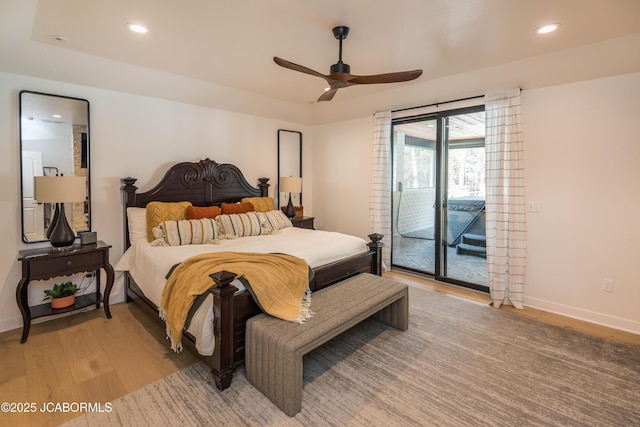 bedroom with light wood-style flooring, recessed lighting, and access to exterior
