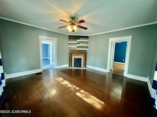 112 W 6th St, Fulton, MO 65251 - unfurnished living room featuring ceiling fan, hardwood / wood-style floors, ornamental molding, a fireplace with raised hearth, and baseboards