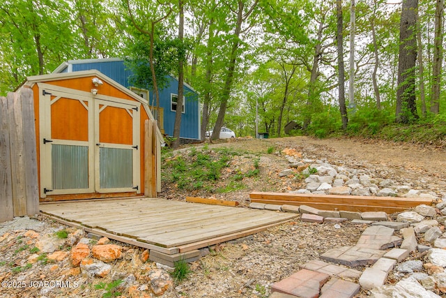 view of yard featuring a storage shed and an outdoor structure