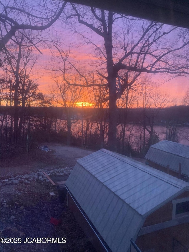 26792 Boone Rd, Barnett, MO 65011 - view of deck at dusk