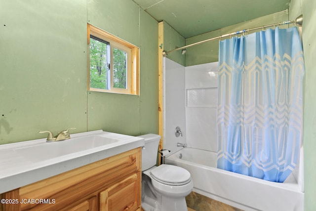 bathroom with shower / bathtub combination with curtain, toilet, and vanity
