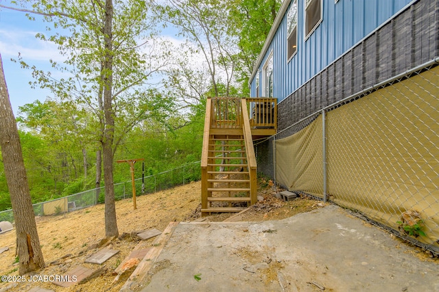 26792 Boone Rd, Barnett, MO 65011 - view of jungle gym featuring stairway, a patio area, fence, and a wooden deck