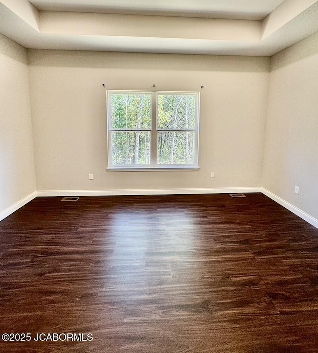 1680 W Fenton Rd, Columbia, MO 65202 - spare room with wood finished floors, visible vents, and baseboards