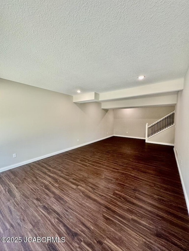 1680 W Fenton Rd, Columbia, MO 65202 - finished basement with baseboards, recessed lighting, a textured ceiling, and dark wood-style flooring