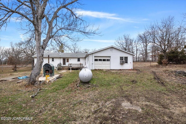 back of house featuring cooling unit, a garage, and a deck