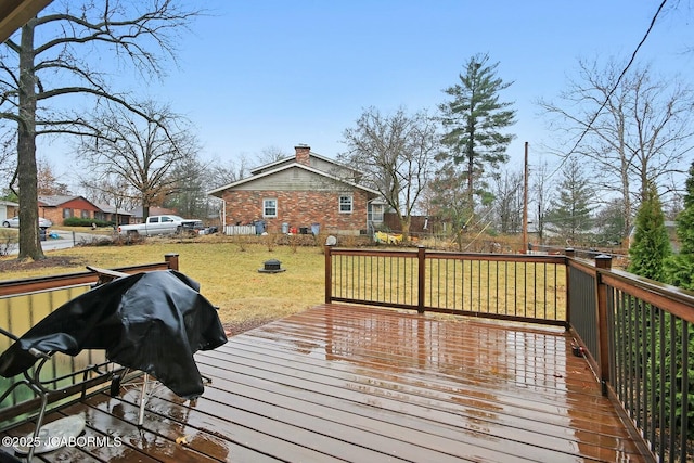 deck with a yard and a grill