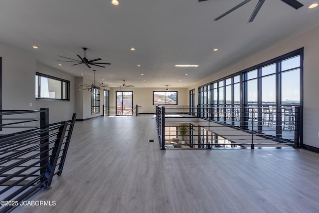 100 Blue Heron Hill Ln Unit 103, Lake Ozark, MO 65049 - empty room featuring ceiling fan, wood finished floors, and recessed lighting