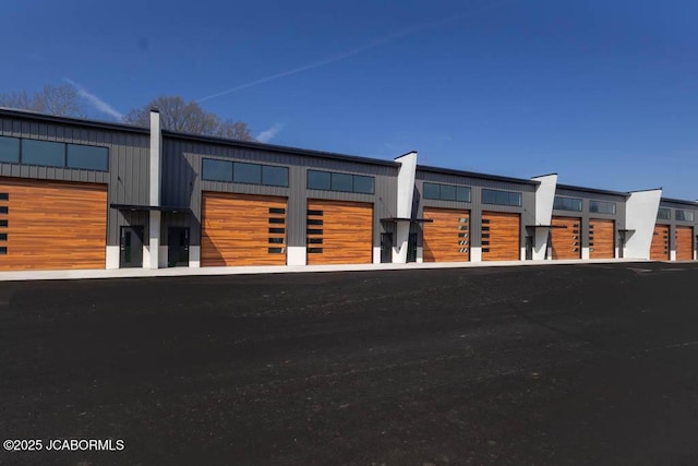 100 Blue Heron Hill Ln Unit 103, Lake Ozark, MO 65049 - view of building exterior featuring a garage