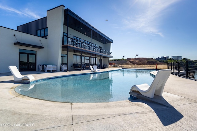 100 Blue Heron Hill Ln Unit 103, Lake Ozark, MO 65049 - view of pool with a water slide, a patio area, and french doors