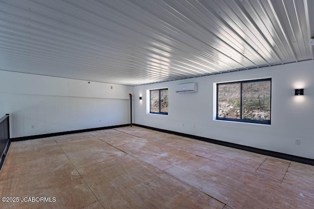 100 Blue Heron Hill Ln Unit 103, Lake Ozark, MO 65049 - unfurnished room with a wall mounted air conditioner and baseboards