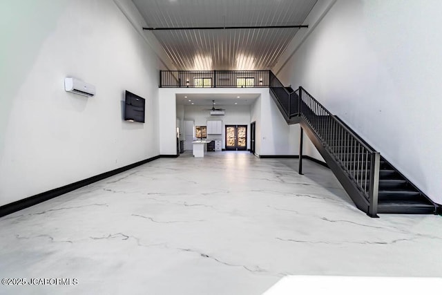 100 Blue Heron Hill Ln Unit 103, Lake Ozark, MO 65049 - stairs with ceiling fan, marble finish flooring, and a towering ceiling