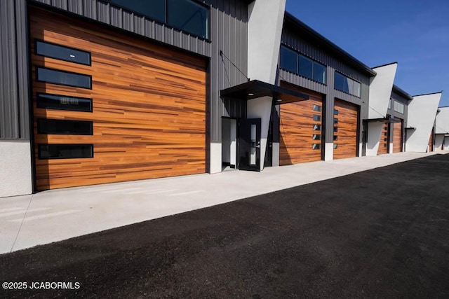 100 Blue Heron Hill Ln Unit 103, Lake Ozark, MO 65049 - exterior space with an attached garage