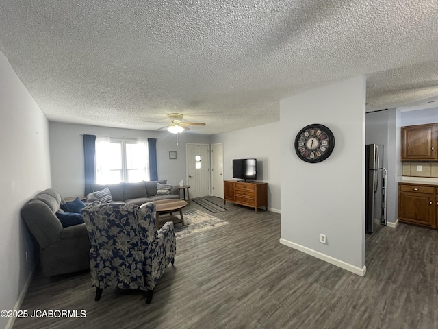 living room with ceiling fan and dark hardwood / wood-style floors