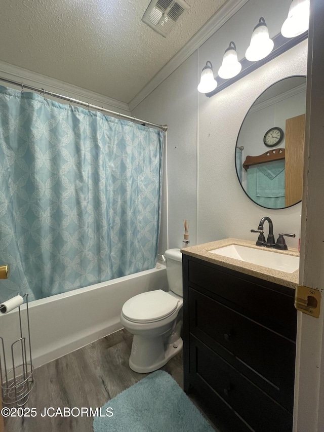 full bath with a textured ceiling, toilet, shower / tub combo, wood finished floors, and crown molding