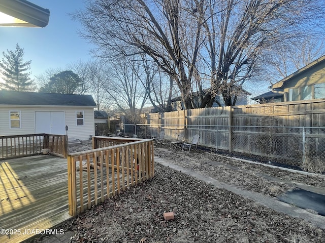 view of yard with a fenced backyard and a wooden deck