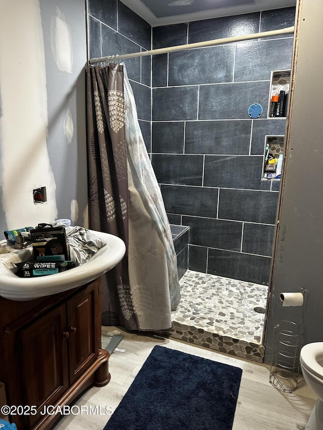 618 E Jefferson St, Linn, MO 65051 - bathroom with a stall shower, wood finished floors, and toilet