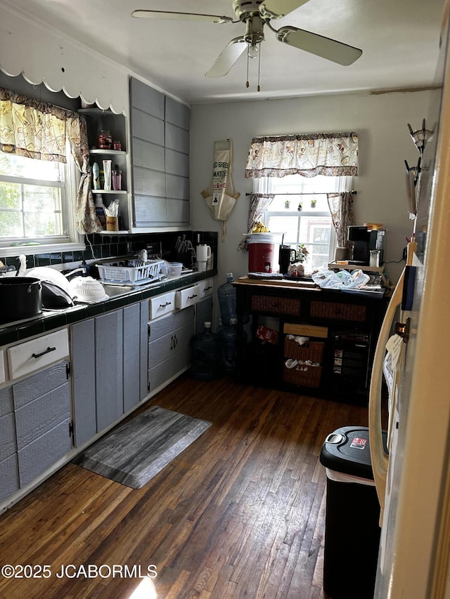 618 E Jefferson St, Linn, MO 65051 - kitchen featuring tile countertops, gray cabinets, dark wood-style flooring, ceiling fan, and open shelves