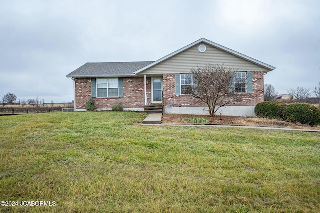 single story home featuring a front yard