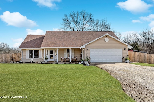 ranch-style house with a garage, covered porch, and a front lawn