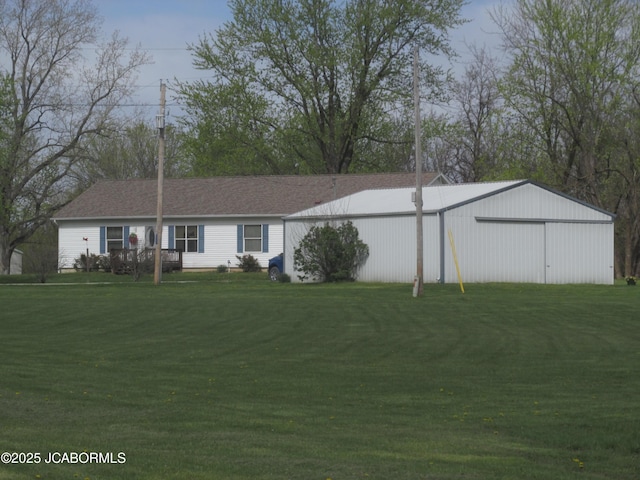 ranch-style house featuring a front yard, an outbuilding, and a pole building