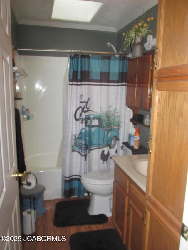 bathroom with shower / bath combination with curtain, toilet, crown molding, vanity, and wood finished floors