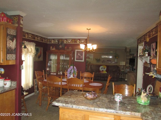 carpeted dining space featuring an inviting chandelier and ornamental molding