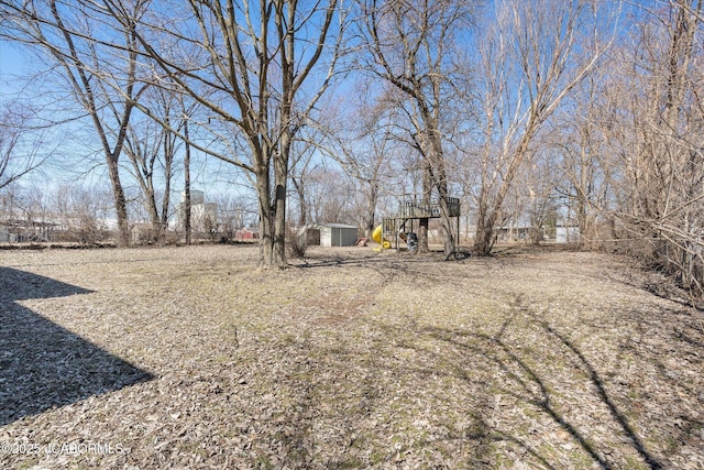 view of yard with an outbuilding and a shed