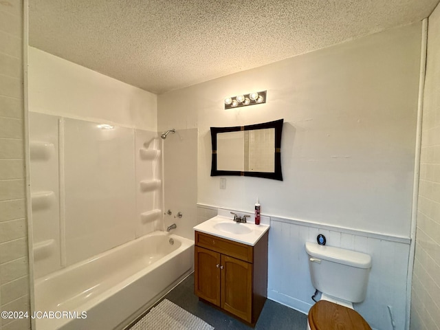 full bathroom with a textured ceiling, vanity, toilet, and shower / bathtub combination