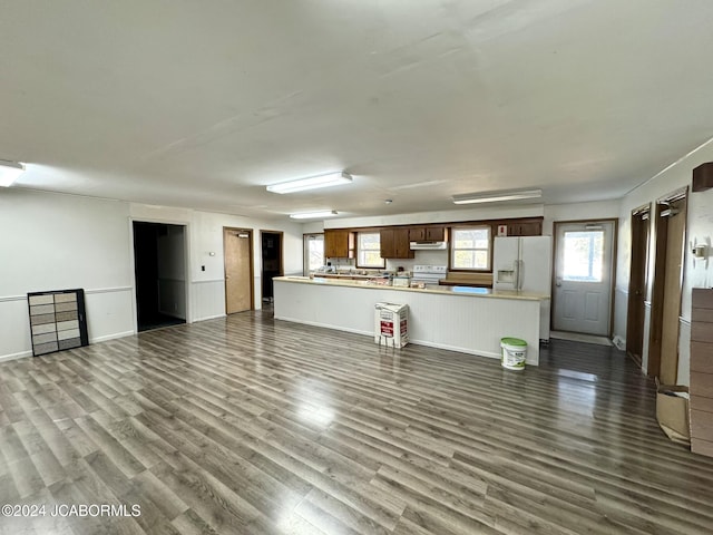 unfurnished living room featuring dark hardwood / wood-style floors