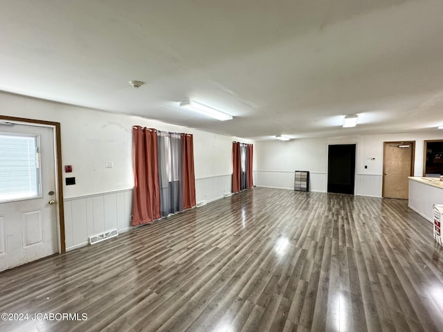 empty room with dark hardwood / wood-style flooring