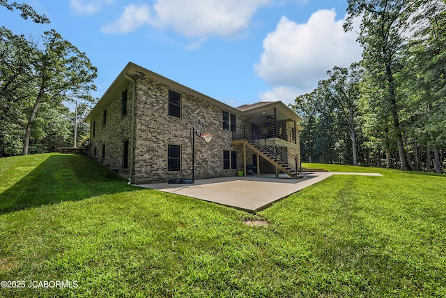 11169 Ridge Fork Dr, Holts Summit, MO 65043 - back of house featuring stairs, a patio, a lawn, and a ceiling fan
