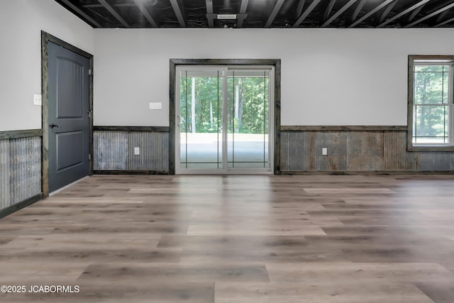11169 Ridge Fork Dr, Holts Summit, MO 65043 - spare room featuring a wainscoted wall and wood finished floors