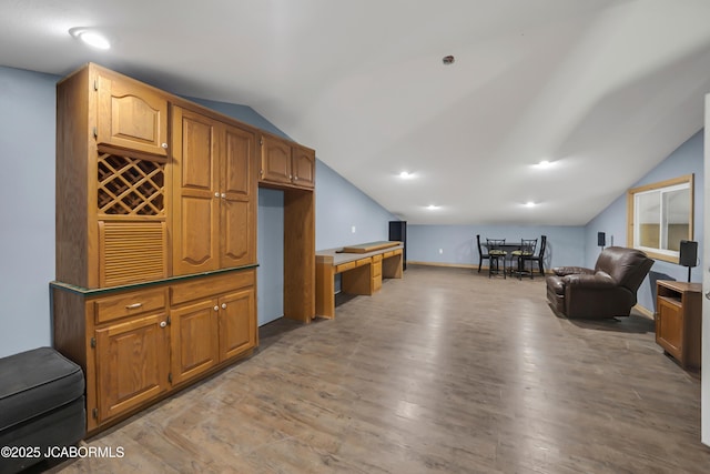 11169 Ridge Fork Dr, Holts Summit, MO 65043 - living room with vaulted ceiling and light wood-style flooring