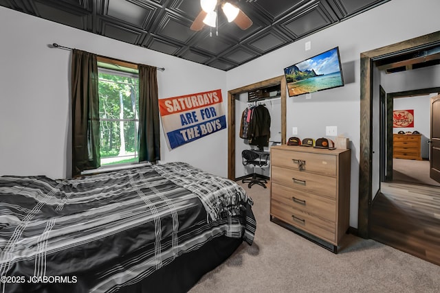 11169 Ridge Fork Dr, Holts Summit, MO 65043 - bedroom featuring a closet, an ornate ceiling, light colored carpet, and ceiling fan
