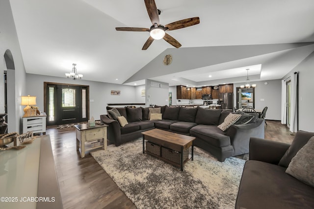11169 Ridge Fork Dr, Holts Summit, MO 65043 - living area featuring a chandelier, lofted ceiling, dark wood-type flooring, a ceiling fan, and arched walkways