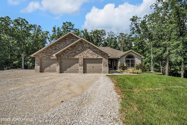 11169 Ridge Fork Dr, Holts Summit, MO 65043 - ranch-style home with dirt driveway, brick siding, a garage, and a front lawn