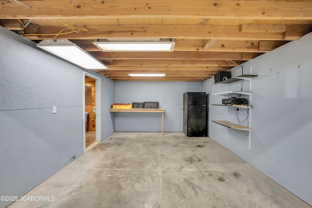 11169 Ridge Fork Dr, Holts Summit, MO 65043 - unfinished basement featuring freestanding refrigerator