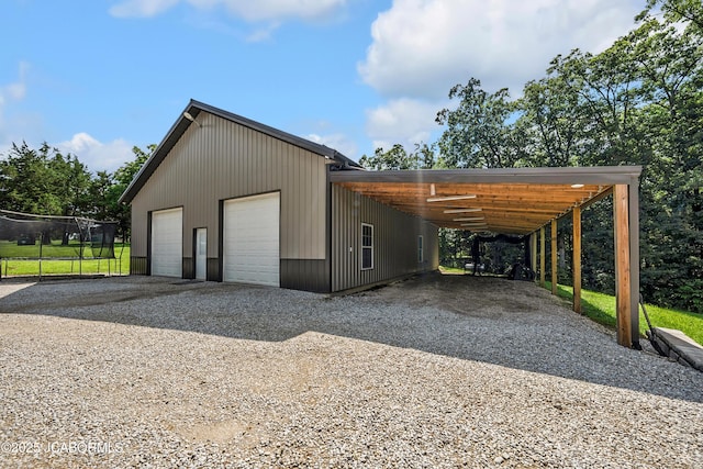 11169 Ridge Fork Dr, Holts Summit, MO 65043 - garage with a detached garage and driveway