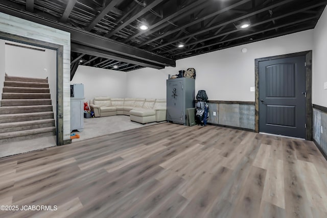 11169 Ridge Fork Dr, Holts Summit, MO 65043 - finished below grade area with wood finished floors, stairs, and a wainscoted wall