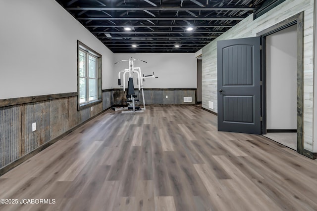 11169 Ridge Fork Dr, Holts Summit, MO 65043 - exercise area with a wainscoted wall and wood finished floors