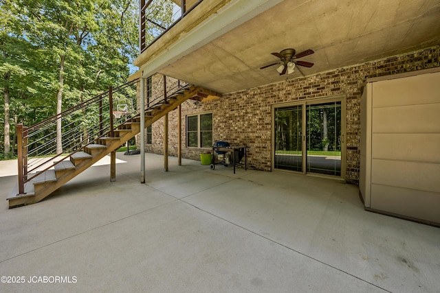 11169 Ridge Fork Dr, Holts Summit, MO 65043 - view of patio featuring ceiling fan and stairs