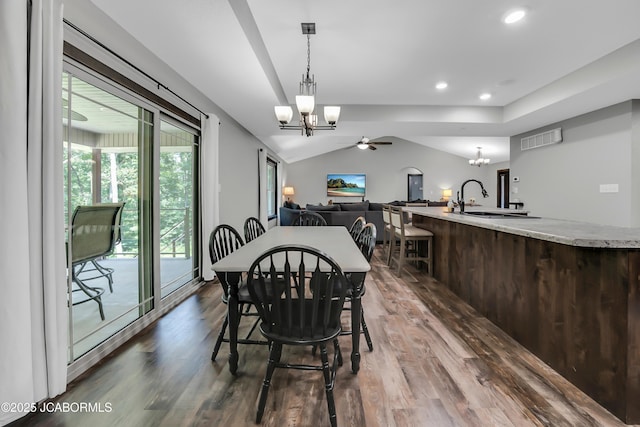 11169 Ridge Fork Dr, Holts Summit, MO 65043 - dining area featuring a chandelier, dark wood-style flooring, ceiling fan, lofted ceiling, and recessed lighting