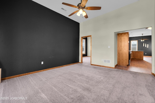 822 Center St, Fulton, MO 65251 - carpeted empty room with a ceiling fan and high vaulted ceiling