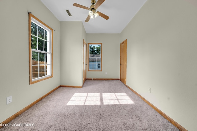 822 Center St, Fulton, MO 65251 - carpeted empty room featuring plenty of natural light and ceiling fan
