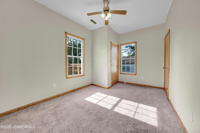 822 Center St, Fulton, MO 65251 - carpeted empty room with plenty of natural light and ceiling fan