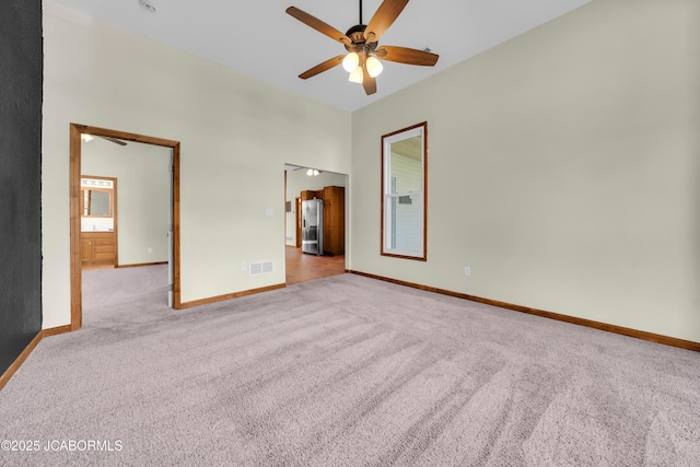 822 Center St, Fulton, MO 65251 - unfurnished bedroom featuring stainless steel fridge with ice dispenser, carpet, and ceiling fan