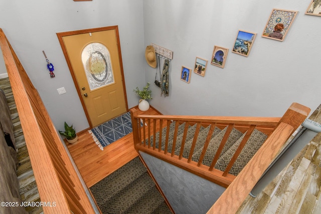 foyer with stairway and wood finished floors